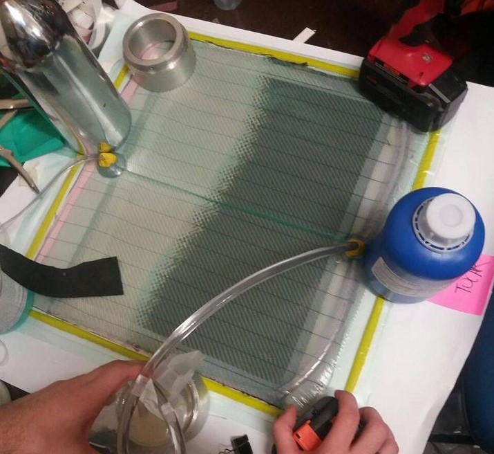 Carbon fiber fin during vacuum infusion lamination